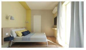 a bedroom with a bed in a room with a window at B&B Ciocca II in Campobasso