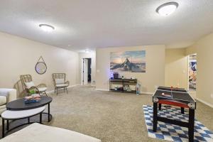 a living room with a ping pong table in it at Basketball Court, Pickleball, Karaoke, 6 Beds in Minneapolis