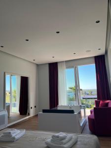 a living room with a pool table and some windows at Top Villas Durres in Durrës +254 photos