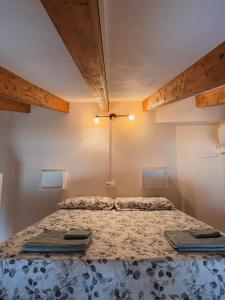 a bedroom with a bed with two laptops on it at Kiboko Beach in Villajoyosa