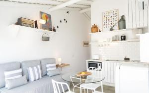 a living room with a couch and a table at Casas da Praia - Casas da Amieira in Amieira