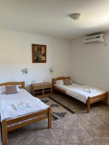 Postel nebo postele na pokoji v ubytování Hotel Višegrad