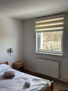 Postel nebo postele na pokoji v ubytování Hotel Višegrad