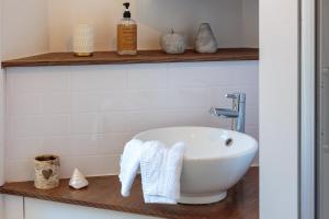 a bathroom with a white sink on a counter at Stravaig in Innerleithen +37 photos