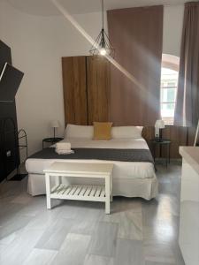 Ένα ή περισσότερα κρεβάτια σε δωμάτιο στο ISA Cádiz