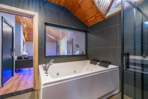 a bath tub in a bathroom with a window at Royal Nest in Istanbul