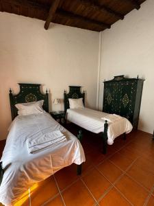 Giường trong phòng chung tại Casa Grande - Amieira Houses +8 ảnh