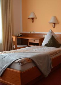 Ένα ή περισσότερα κρεβάτια σε δωμάτιο στο Hotel Blocksberg