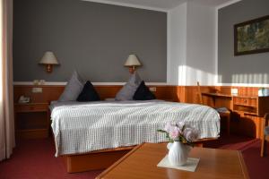 Ένα ή περισσότερα κρεβάτια σε δωμάτιο στο Hotel Blocksberg