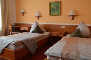 Ένα ή περισσότερα κρεβάτια σε δωμάτιο στο Hotel Blocksberg