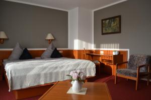 Ένα ή περισσότερα κρεβάτια σε δωμάτιο στο Hotel Blocksberg
