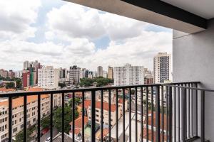 a view of a city from a balcony at NK | Vila Mariana | Localização Perfeita in São Paulo