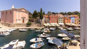 a group of boats are docked in a harbor at B&B Ciao Bella in Veli Lošinj