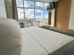 Katil atau katil-katil dalam bilik di Elite Business Hotel
