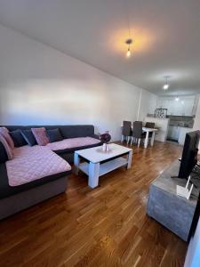 a living room with a couch and a table at Dora Apartman in Trebinje
