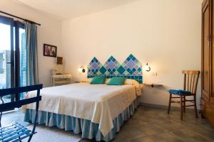 Postel nebo postele na pokoji v ubytování Casa Magnolia San Pantaleo