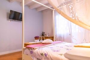 Postel nebo postele na pokoji v ubytování Grande Appartamento sulle Dolomiti