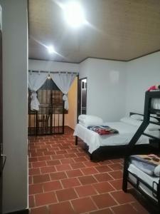 Curitagua Hotel Campestre客房内的一张或多张床位