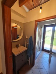 a bathroom with a sink and a mirror at la valle country house in Vasto
