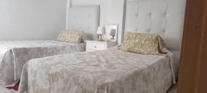 Una cama o camas en una habitación de Appartement Riad Tanger
