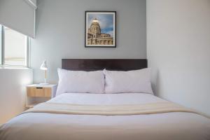 Ένα ή περισσότερα κρεβάτια σε δωμάτιο στο Stunning 3BR in Miraflores