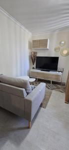 a living room with a couch and a table at La Casetta in Pescolanciano +10 photos