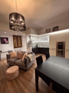 a living room with a couch and a table at Gemmas home in Uboldo