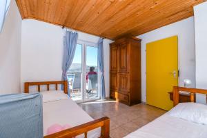 Posteľ alebo postele v izbe v ubytovaní Apartment Doktor + 9 fotografií