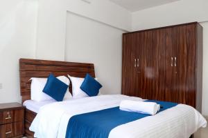 Postel nebo postele na pokoji v ubytování Zenith Homes - Boomerang Suites