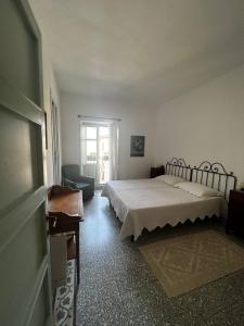 Postel nebo postele na pokoji v ubytování Locanda Li Manni