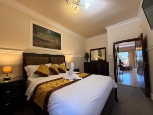 Posteľ alebo postele v izbe v ubytovaní Mountain Resort Residences