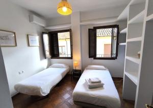 Ένα ή περισσότερα κρεβάτια σε δωμάτιο στο Apartamento Balcón de los Descalzos