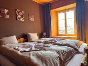 Postel nebo postele na pokoji v ubytování Auberge de l'Ange