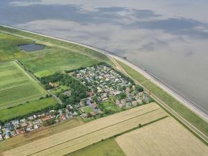 an aerial view of a city next to a body of water at Holiday Home Wiringherlant-2 by Interhome in Hippolytushoef