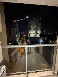 a view of a city at night from a balcony at Depto de 2habitaciones, zona centrica in Asuncion
