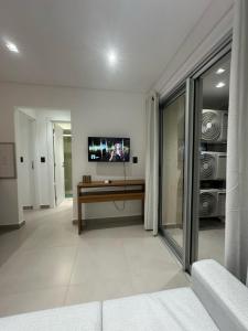 a living room with a tv on the wall at Depto de 2habitaciones, zona centrica in Asuncion