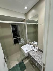 a bathroom with a sink and a mirror at Depto de 2habitaciones, zona centrica in Asuncion +68 photos