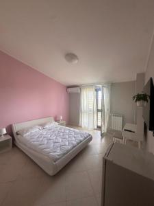 Postel nebo postele na pokoji v ubytování Sicily Emotion Special Rooms