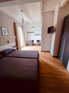 a bedroom with a bed and a desk in a room at Villa Celeste in Brusciano +74 photos