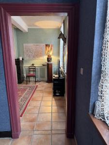 a hallway with a view of a living room at Appartement Centre Ville in Mirepoix