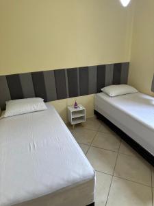 Ένα ή περισσότερα κρεβάτια σε δωμάτιο στο Apartamento aconchegantes em AC