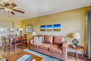 a living room with a couch and a table at Camelback House in Scottsdale