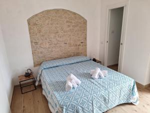 Postel nebo postele na pokoji v ubytování Dommu Amsicora Piano 1