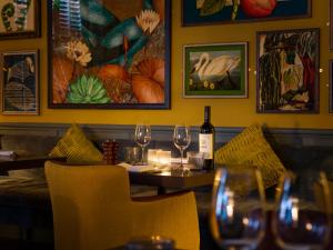 a dining room with a table with wine glasses at The Kings Arms in Christchurch