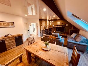 a living room with a table and a couch at Casa Bob in Mettlach