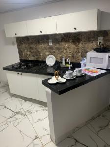 Η κουζίνα ή μικρή κουζίνα στο Apartamento para 4 pessoas bem localizado