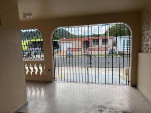 an entrance to a building with a gate at A1-tg Family Oriented Stay in Caguas +7 photos