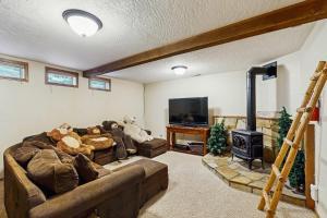 a living room with a couch with stuffed animals on it at Stedman Cabin in McCall