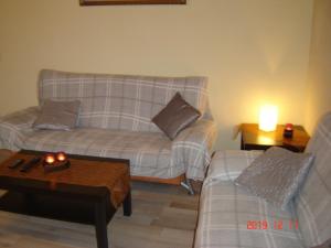 a living room with a couch and a coffee table at Santa Maria in Nettersheim