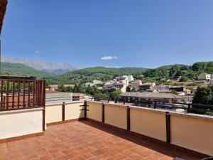 a balcony with a view of a city at Apartamento Triana Rio in Arenas de San Pedro